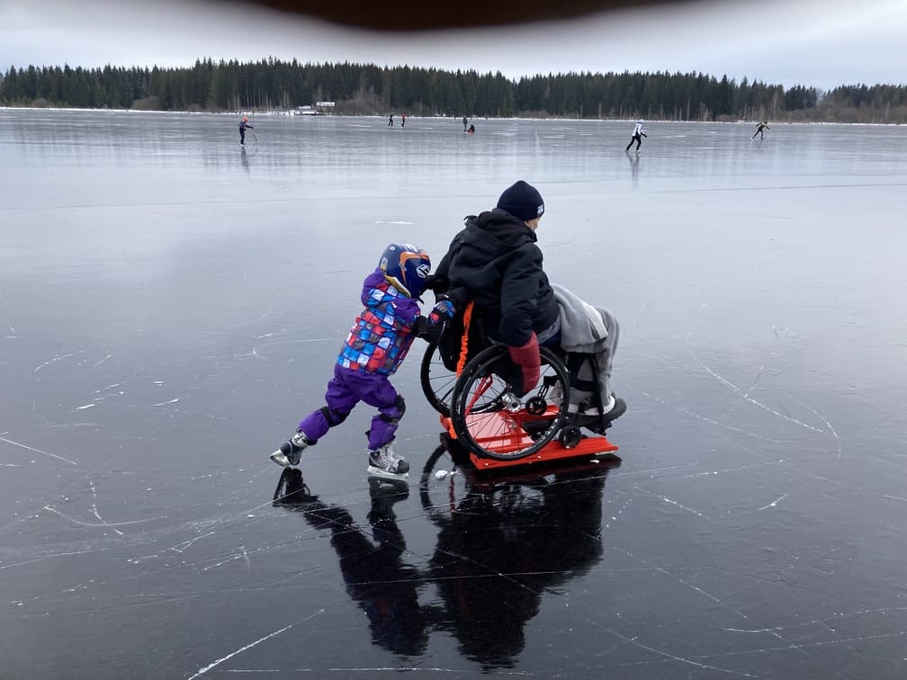 the joy of sliding on a frozen lake for the severely disabled